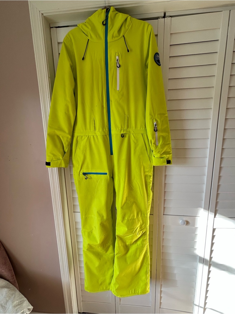 Woman’s Neon Yellow Hooded One-Piece Snowboarding Suit